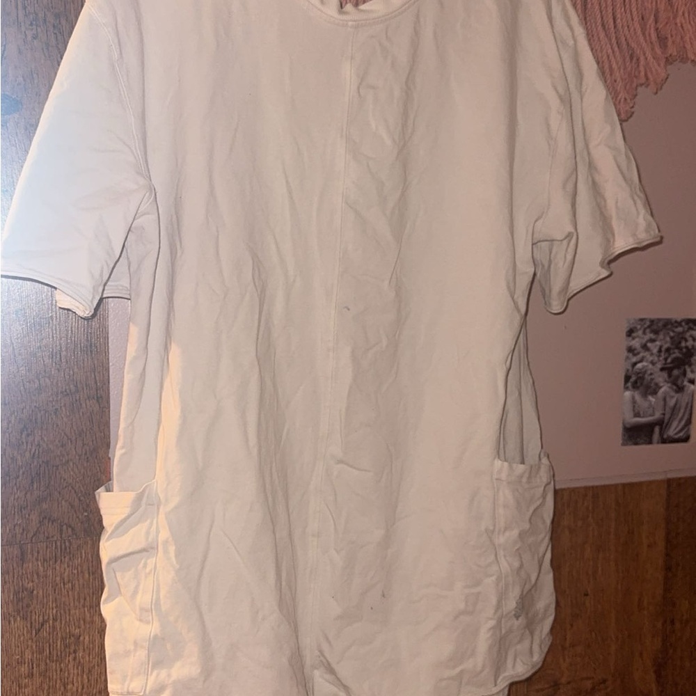 The item in the image is a Free People Movement Hot Shot Tee Romper.